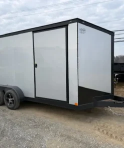 Ding & Dent Covered Wagon 7 x 16 Enclosed Cargo Trailer – All American Edition with dual axles, silver and black exterior, side door, and alloy wheels.